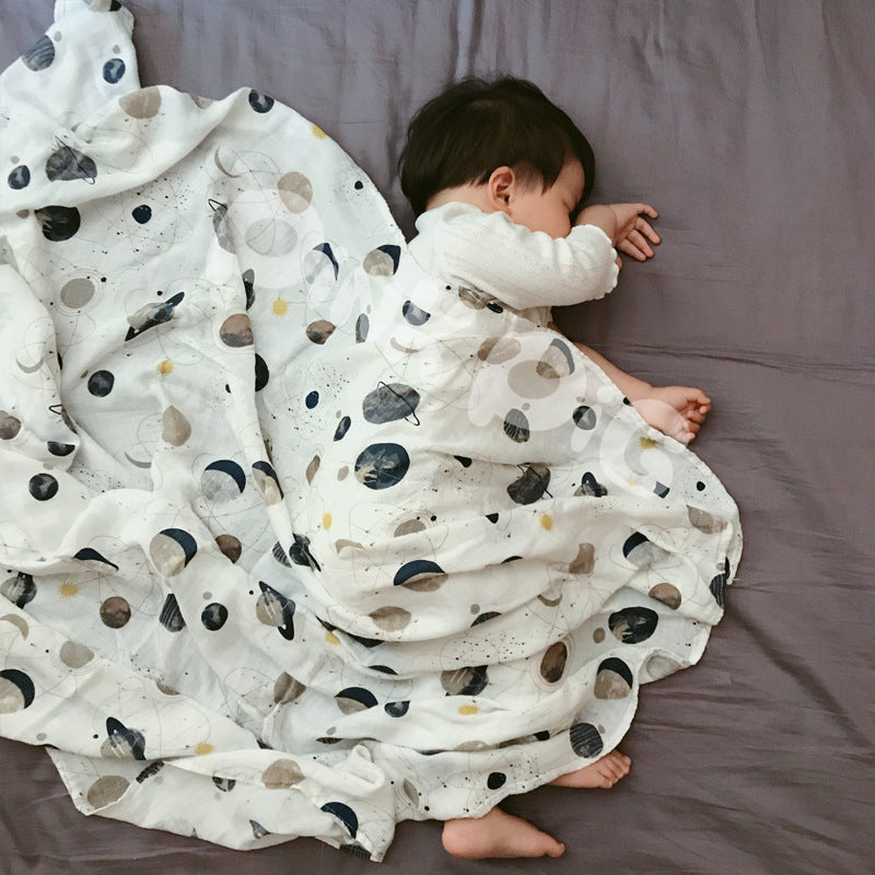 Baby Care holding a blanket towel