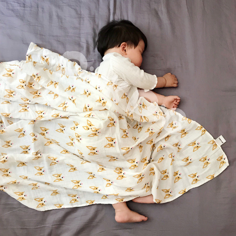 Baby Care holding a blanket towel