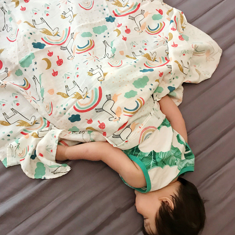 Baby Care holding a blanket towel