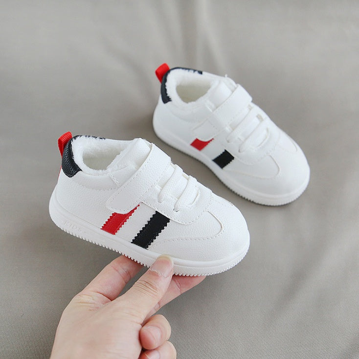 Little white Velcro baby shoes
