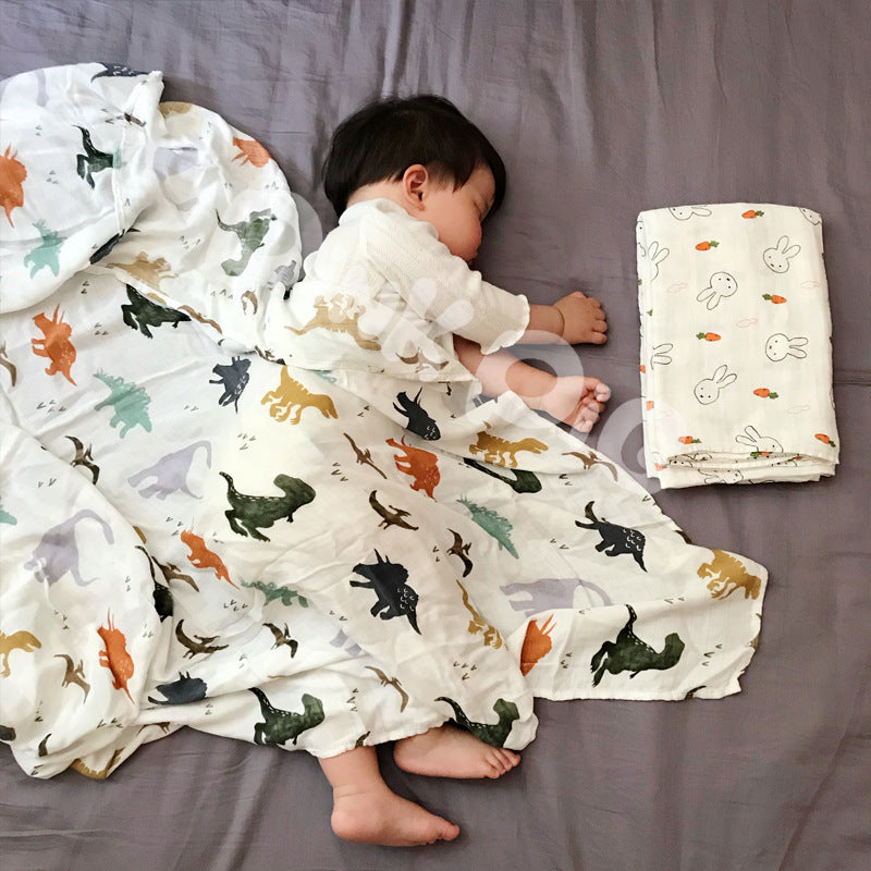 Baby Care holding a blanket towel