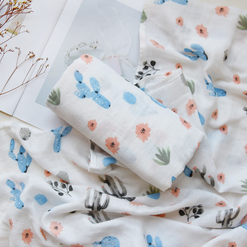 Baby Care holding a blanket towel