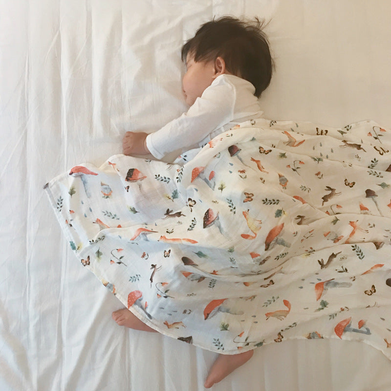 Baby Care holding a blanket towel