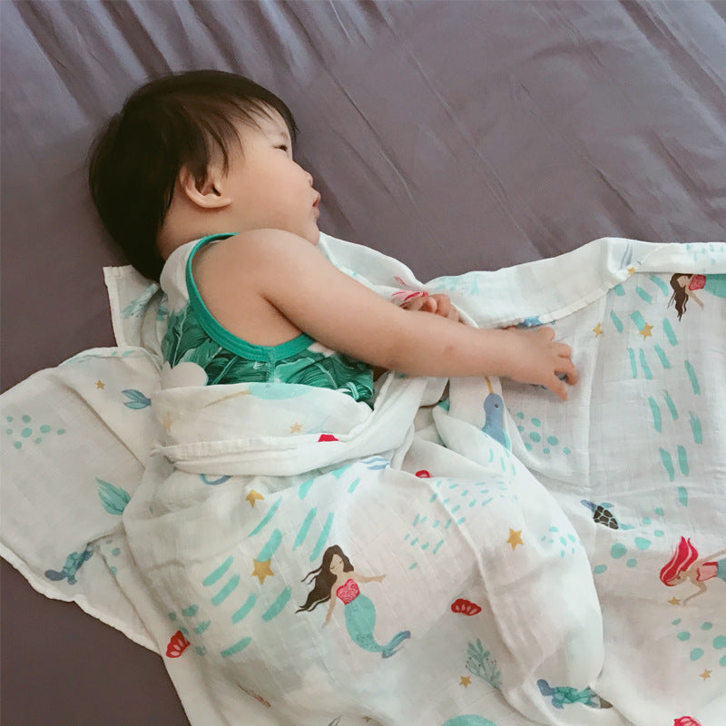 Baby Care holding a blanket towel
