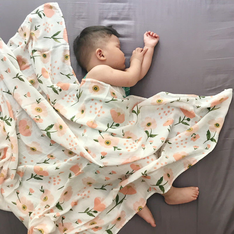 Baby Care holding a blanket towel